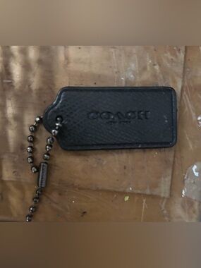 Black Coach Tag